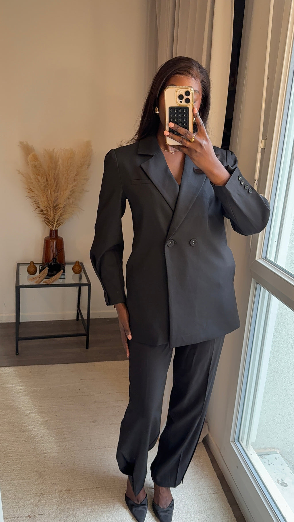 Blazer noir à boutons et avec ceinture